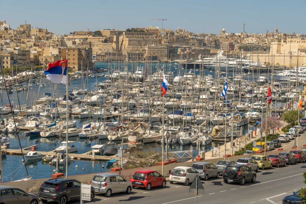 malta harbor boats and fort rinella in the background